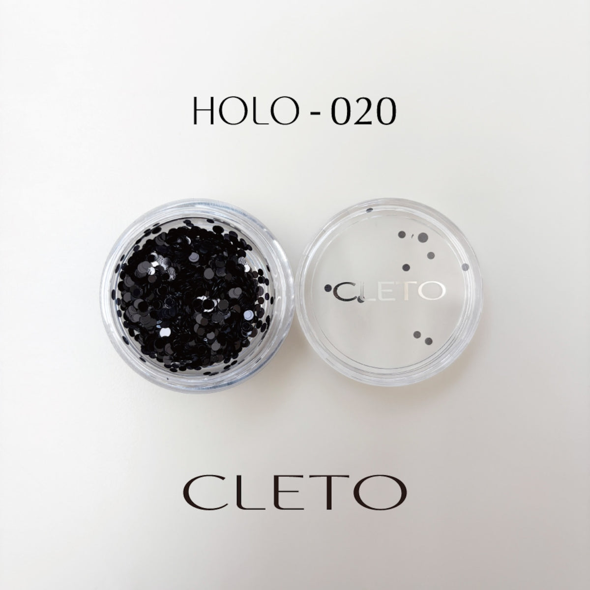 Cleto black rounded holo sequins for nail art.