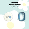 A Japanese cateye gel product graphic for the Enoi Summer Glass Magnet Gel in mg168. The image shows a round white potted gel labeled 'mg168 énoi' with a small blue shimmery swatch and a matching blue magnet nail sample beside it. Available at Mellow Edit. 